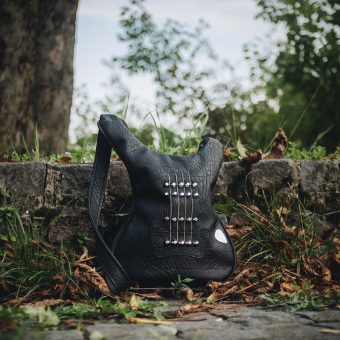 Black Jewel Rock and Roll Bag - Handcrafted leather bag shaped like a guitar bass, perfect for music lovers and rockstars.