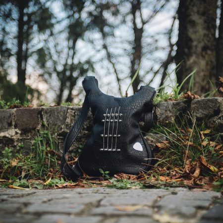 Black Jewel Rock and Roll Bag - Handcrafted leather bag shaped like a guitar bass, perfect for music lovers and rockstars.