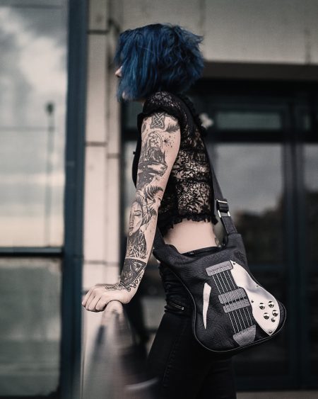 Classic black guitar crossbody bag with real guitar strings, a stylish accessory from Bysolbags