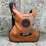 Brown leather acoustic guitar shaped bag, perfect for music lovers - BySolbags.com