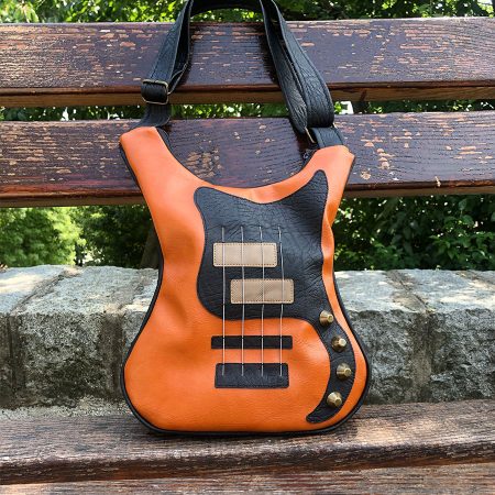 Brown bass leather guitar shaped bag - the perfect accessory for rock enthusiasts.