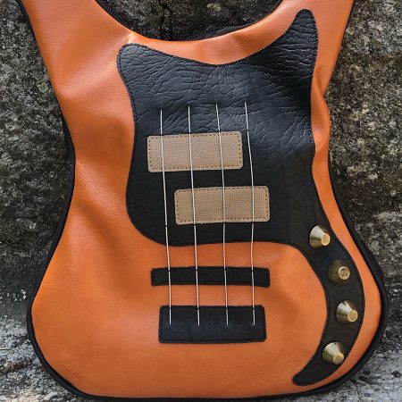 Brown bass leather guitar shaped bag - the perfect accessory for rock enthusiasts.
