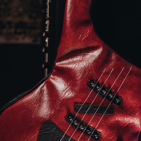 Red leather guitar-shaped bag with studded and sewn strings - Bysolbags