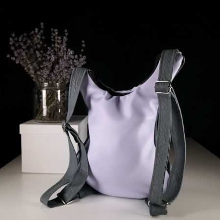 Lavender backpack in guitar-shaped design with sewed strings and studded guitar knobs