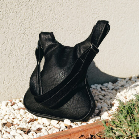black guitar shaped bag