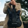 Black leather bass bag with real guitar strings, a perfect rock-themed accessory from Bysolbags