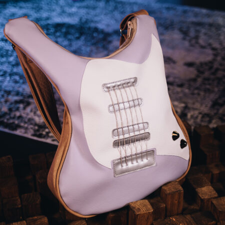 Pastel purple handmade guitar-shaped bag with real guitar strings, a unique fashion statement from Bysolbags