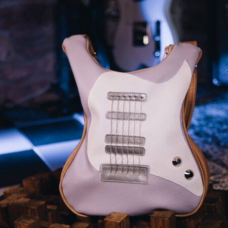 Pastel purple handmade guitar-shaped bag with real guitar strings, a unique fashion statement from Bysolbags